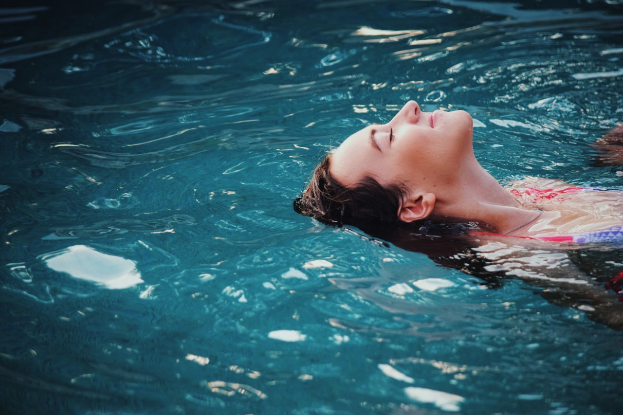 Woman in Pool | Suzanne Polino REALTOR